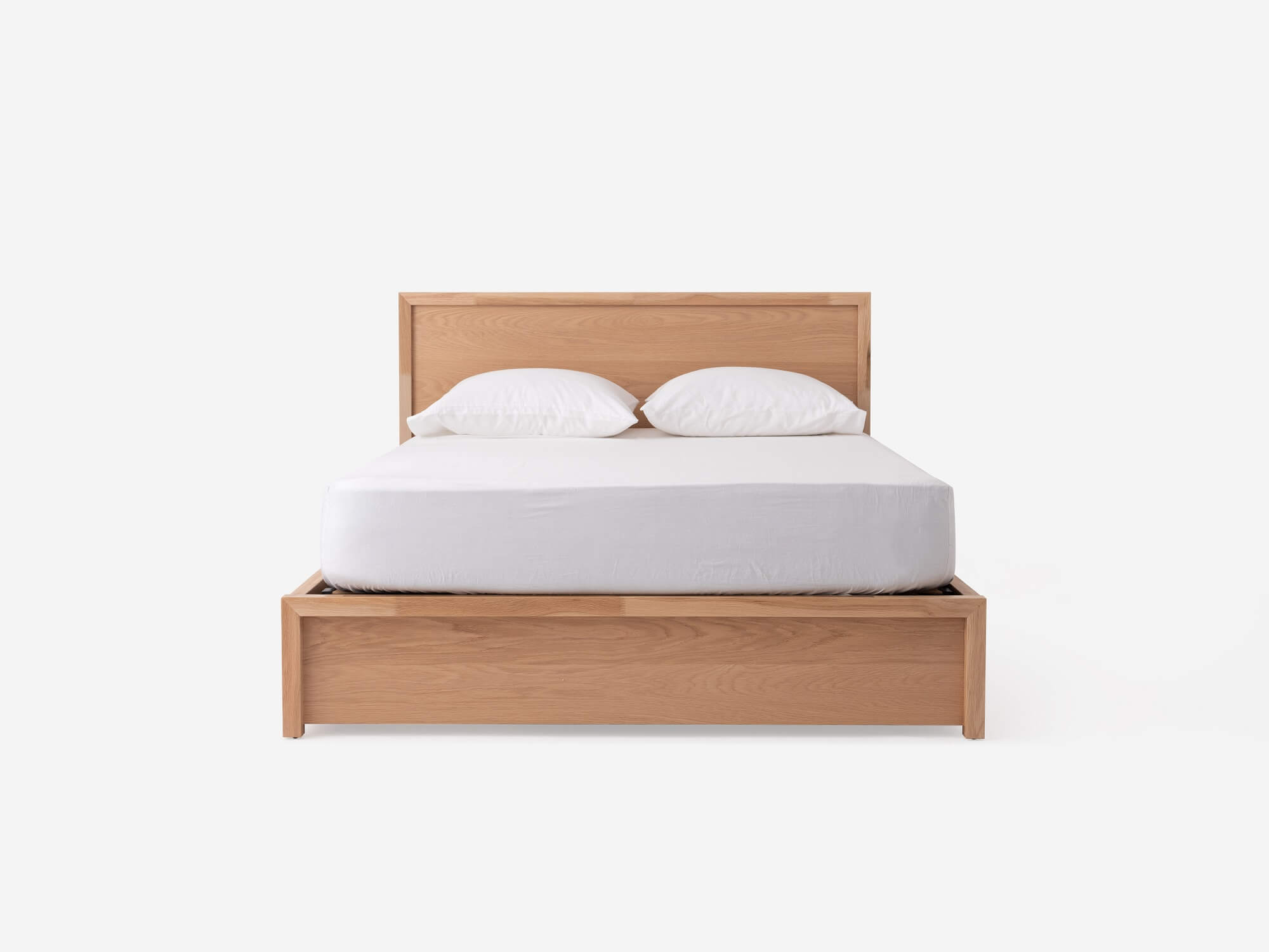 Front view of Marcel lift up storage bed in oak